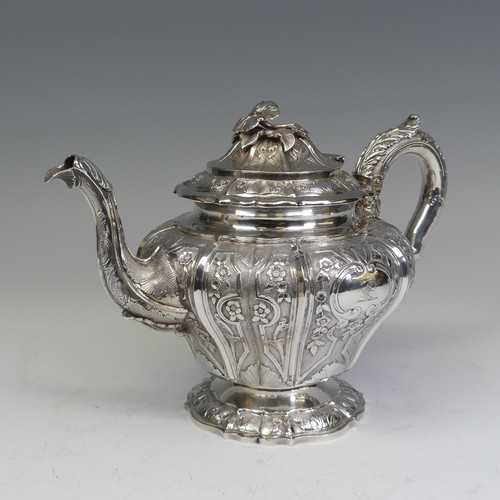 31 - An early Victorian silver melon shaped Teapot, by J E Terrey & Co., hallmarked London 1843, with... 