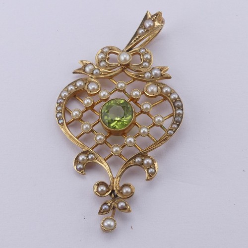 238 - A pretty Edwardian peridot and seed pearl Pendant, in the Art Nouveau style with seed pearl set latt... 