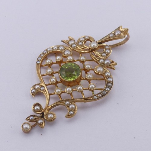 238 - A pretty Edwardian peridot and seed pearl Pendant, in the Art Nouveau style with seed pearl set latt... 