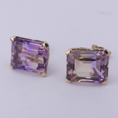 313 - A pair of tourmaline stud Earrings, the emerald cut stones, approx. 9x7mm, with colour variance oran... 