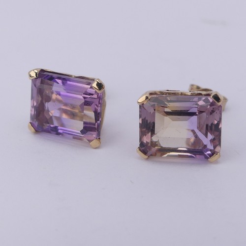 313 - A pair of tourmaline stud Earrings, the emerald cut stones, approx. 9x7mm, with colour variance oran... 