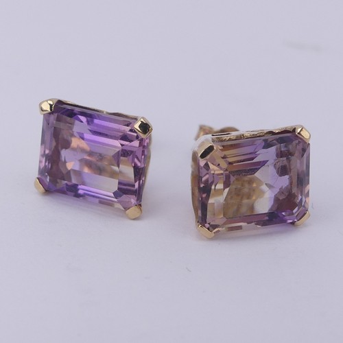 313 - A pair of tourmaline stud Earrings, the emerald cut stones, approx. 9x7mm, with colour variance oran... 