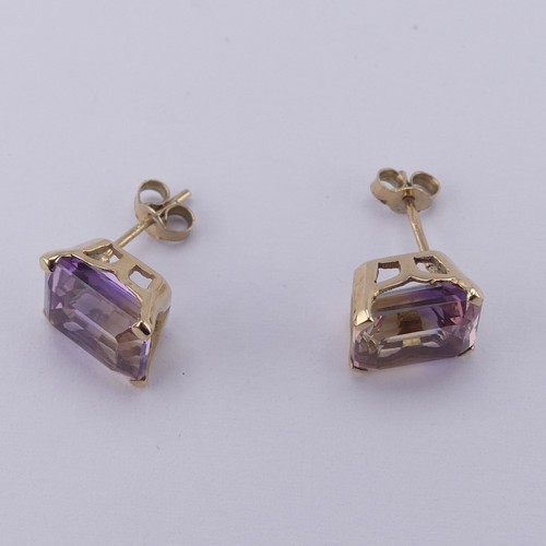 313 - A pair of tourmaline stud Earrings, the emerald cut stones, approx. 9x7mm, with colour variance oran... 