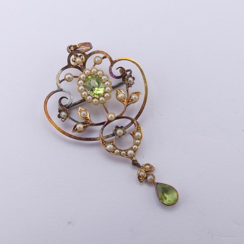 239 - An Edwardian peridot and seed pearl Pendant, in the Art Nouveau style, the central oval facetted per... 