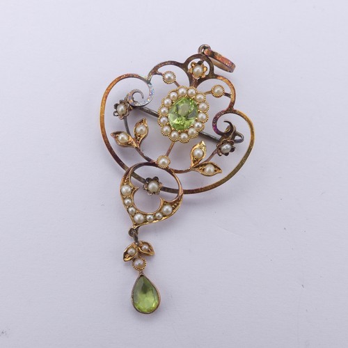 239 - An Edwardian peridot and seed pearl Pendant, in the Art Nouveau style, the central oval facetted per... 