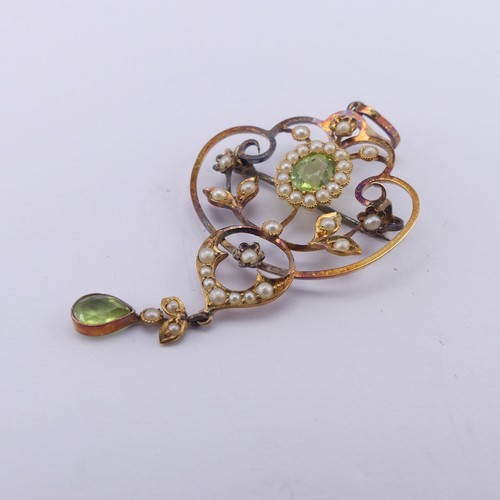 239 - An Edwardian peridot and seed pearl Pendant, in the Art Nouveau style, the central oval facetted per... 