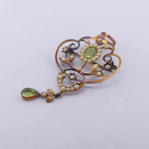 239 - An Edwardian peridot and seed pearl Pendant, in the Art Nouveau style, the central oval facetted per... 