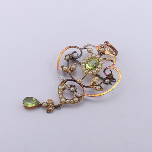 239 - An Edwardian peridot and seed pearl Pendant, in the Art Nouveau style, the central oval facetted per... 