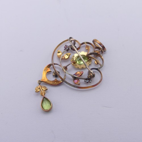 239 - An Edwardian peridot and seed pearl Pendant, in the Art Nouveau style, the central oval facetted per... 