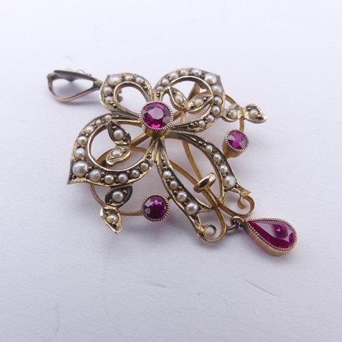 236 - An Edwardian pink sapphire and seed pearl Pendant / Brooch, of Art Nouveau design with three millegr... 