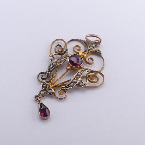 240 - An Edwardian garnet and seed pearl Pendant, in the Art Nouveau style, mounted in 9ct gold,4.8cm long... 