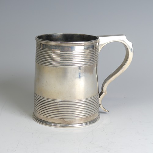 78 - A George III silver Mug, hallmarked London, 1811, makers mark unclear, of circular form with two ban... 