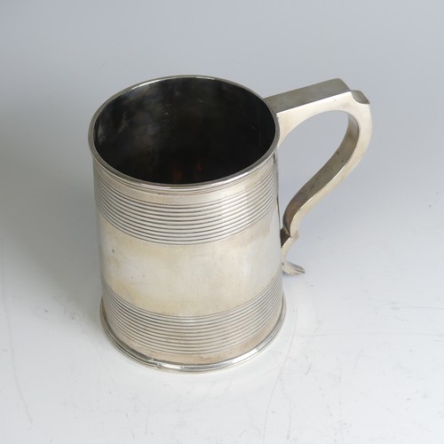 78 - A George III silver Mug, hallmarked London, 1811, makers mark unclear, of circular form with two ban... 