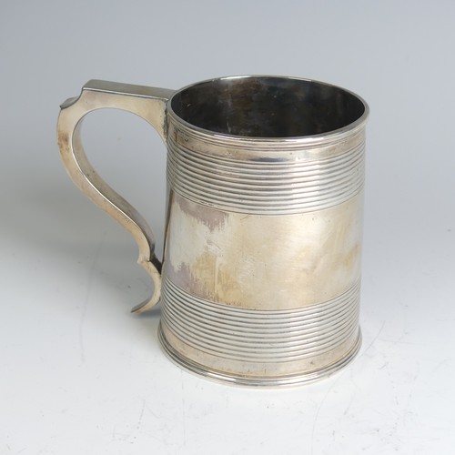 78 - A George III silver Mug, hallmarked London, 1811, makers mark unclear, of circular form with two ban... 