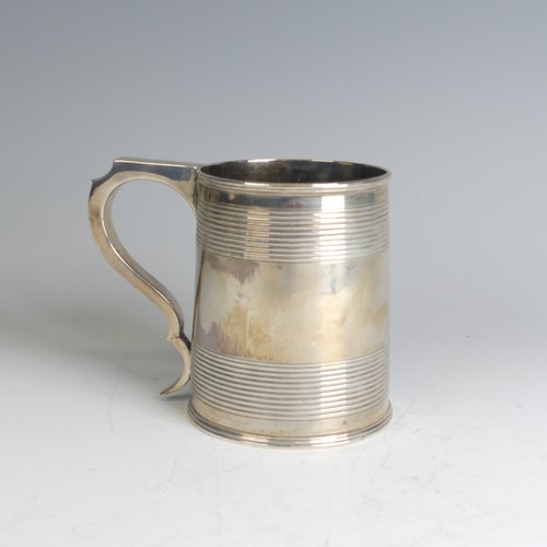 78 - A George III silver Mug, hallmarked London, 1811, makers mark unclear, of circular form with two ban... 