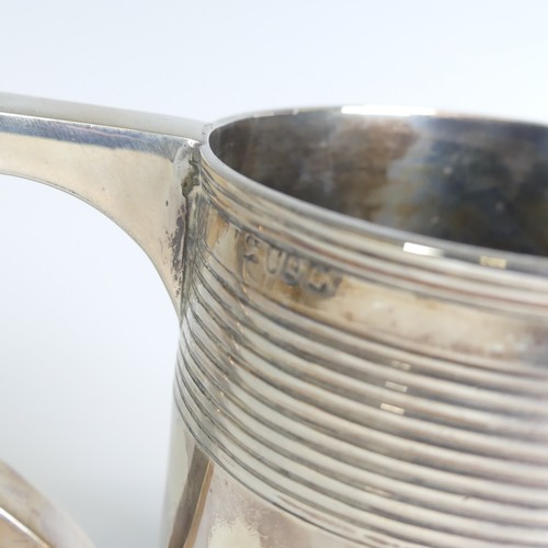 78 - A George III silver Mug, hallmarked London, 1811, makers mark unclear, of circular form with two ban... 