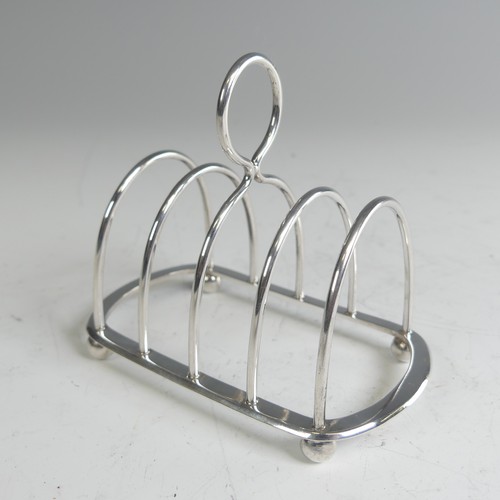 81 - A late Victorian silver five bar Toast Rack, by Hukin & Heath, hallmarked London 1900, 10cm long... 