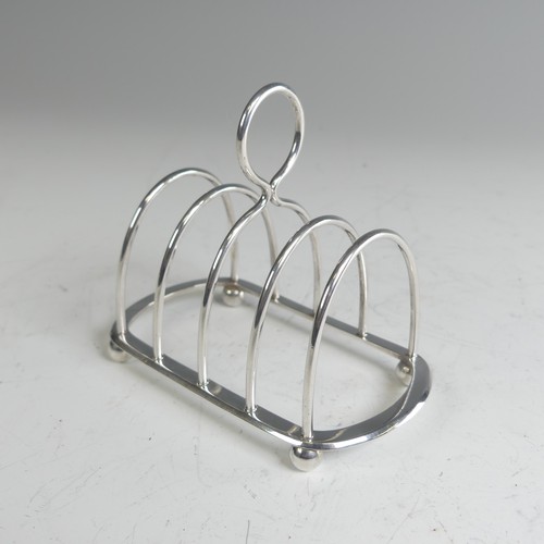 81 - A late Victorian silver five bar Toast Rack, by Hukin & Heath, hallmarked London 1900, 10cm long... 