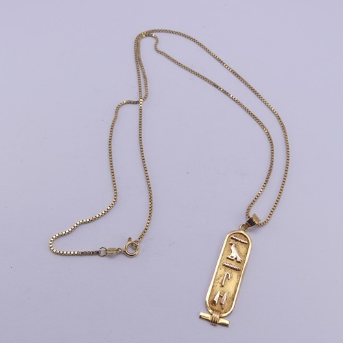 249 - A 18ct yellow gold Egyptian Hieroglyph Pendant, 4.3cm long, on an 18ct gold box link chain, 55cm lon... 