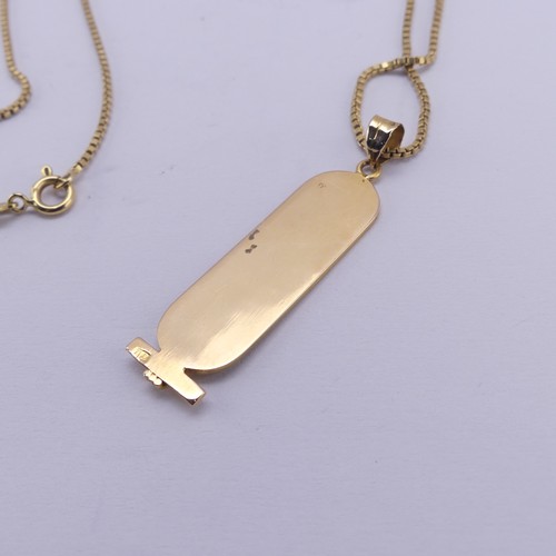 249 - A 18ct yellow gold Egyptian Hieroglyph Pendant, 4.3cm long, on an 18ct gold box link chain, 55cm lon... 