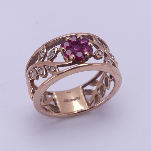 153 - A 9ct rose gold foliate pierced Ring, the front with ruby set flower head with diamond point set lea... 