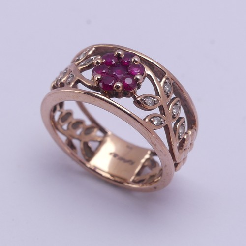 153 - A 9ct rose gold foliate pierced Ring, the front with ruby set flower head with diamond point set lea... 