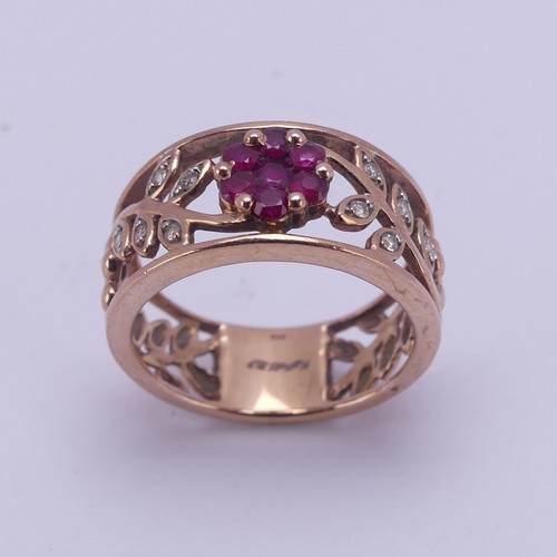 153 - A 9ct rose gold foliate pierced Ring, the front with ruby set flower head with diamond point set lea... 