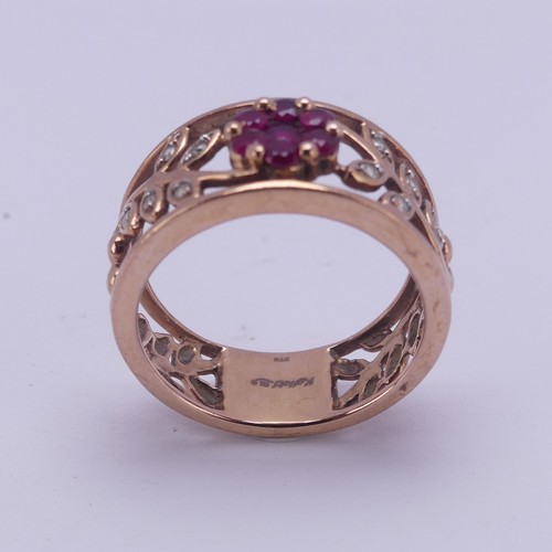 153 - A 9ct rose gold foliate pierced Ring, the front with ruby set flower head with diamond point set lea... 