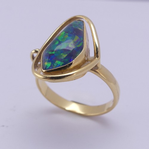 155 - An abstract opal Ring, collet set in 18ct yellow gold, Size Q, 5.8g.