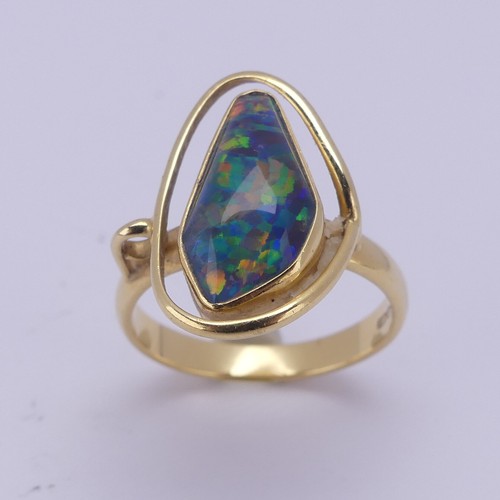 155 - An abstract opal Ring, collet set in 18ct yellow gold, Size Q, 5.8g.