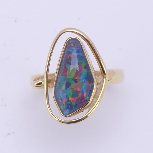 155 - An abstract opal Ring, collet set in 18ct yellow gold, Size Q, 5.8g.