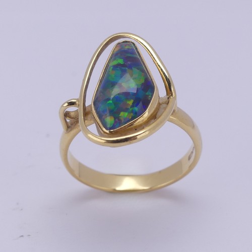 155 - An abstract opal Ring, collet set in 18ct yellow gold, Size Q, 5.8g.