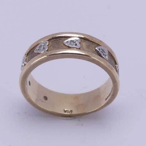 156 - A 9ct yellow gold Band, the textured centre with seven applied white gold hearts set small diamond p... 