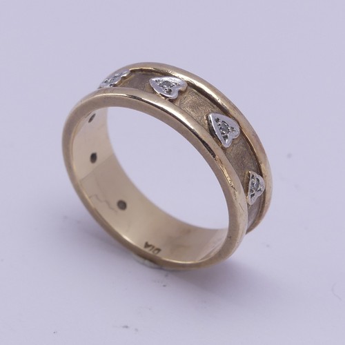 156 - A 9ct yellow gold Band, the textured centre with seven applied white gold hearts set small diamond p... 