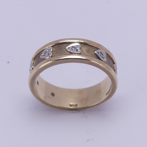 156 - A 9ct yellow gold Band, the textured centre with seven applied white gold hearts set small diamond p... 