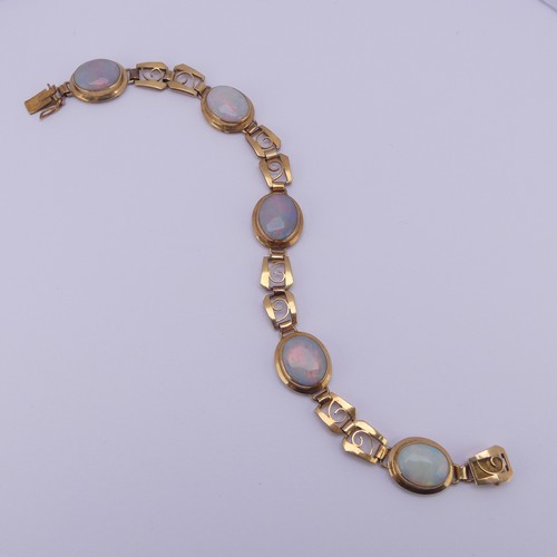 284 - An 18ct yellow gold and opal Bracelet, with five oval cabochon opals each approx. 12mm long, collet ... 