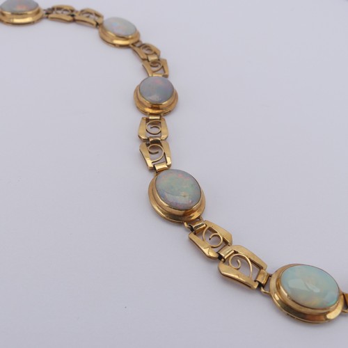 284 - An 18ct yellow gold and opal Bracelet, with five oval cabochon opals each approx. 12mm long, collet ... 