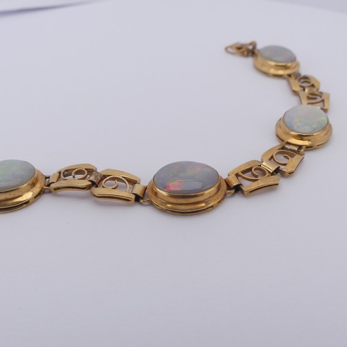 284 - An 18ct yellow gold and opal Bracelet, with five oval cabochon opals each approx. 12mm long, collet ... 