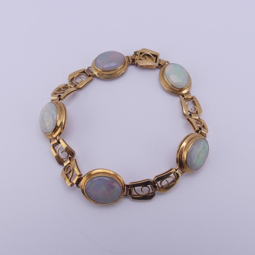 284 - An 18ct yellow gold and opal Bracelet, with five oval cabochon opals each approx. 12mm long, collet ... 