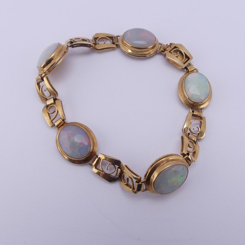 284 - An 18ct yellow gold and opal Bracelet, with five oval cabochon opals each approx. 12mm long, collet ... 