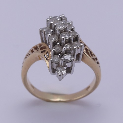 215 - A diamond cluster Dress Ring, the swirl front claw set with nineteen small brilliant cut stones, eac... 