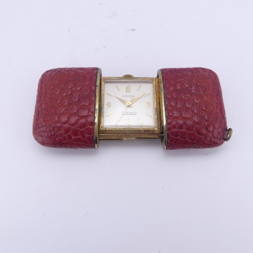 130 - A vintage Komos Purse Watch, with 17-jewels crown wind movement, red leather case, 5.5cm long closed... 