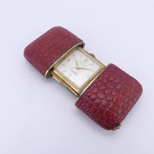 130 - A vintage Komos Purse Watch, with 17-jewels crown wind movement, red leather case, 5.5cm long closed... 