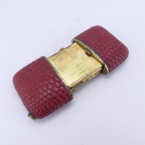 130 - A vintage Komos Purse Watch, with 17-jewels crown wind movement, red leather case, 5.5cm long closed... 