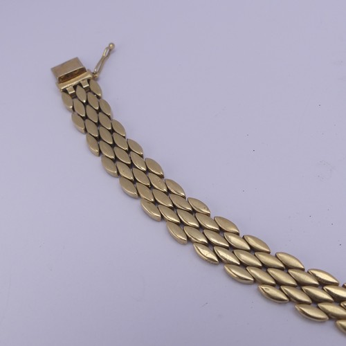 285 - A 14ct yellow gold Bracelet, with flexible navette shaped brick links, marked on the box snap 14k an... 