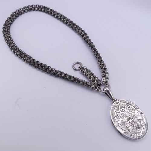 253 - A Victorian silver Locket and Chain, in the Aesthetic style, the locket hallmarked Birmingham 1882, ... 