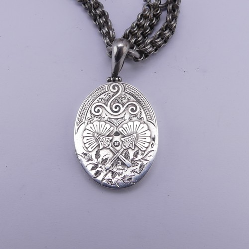 253 - A Victorian silver Locket and Chain, in the Aesthetic style, the locket hallmarked Birmingham 1882, ... 