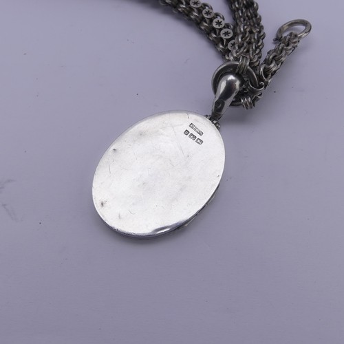 253 - A Victorian silver Locket and Chain, in the Aesthetic style, the locket hallmarked Birmingham 1882, ... 