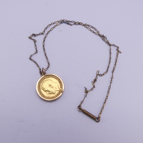 411 - A George V gold Half Sovereign, dated 1913, in unmarked pendant mount, tested as 9ct gold, total wei... 