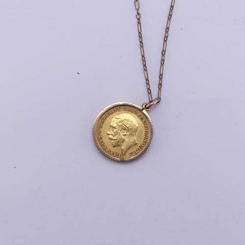 411 - A George V gold Half Sovereign, dated 1913, in unmarked pendant mount, tested as 9ct gold, total wei... 